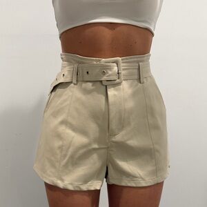 Nude leather shorts with belt.